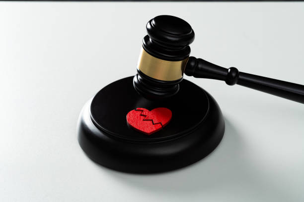 istock Gavel with a broken heart on white background 2172278224