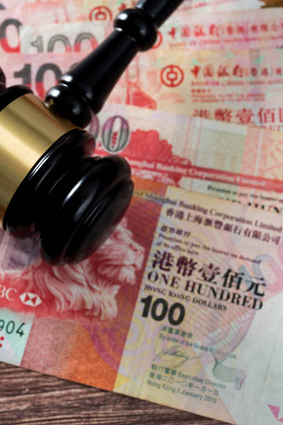 istock Gavel on stack of Hong Kong currency 2172278262