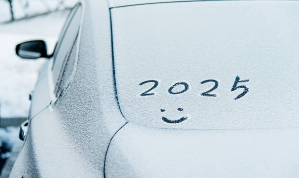 istock New year 2025 and smiling face written on car windshield 2172278570