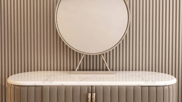 istock White marble top, beige vanity dressing table, steel frame round mirror in sunlight on brown wood panel wall bedroom for luxury beauty, cosmetic, skincare product background 3D 2172280047