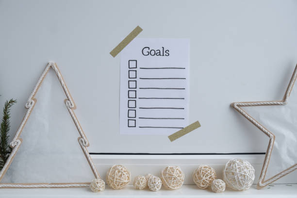 istock Paper note with inspirational to do checklist GOALS with natural zero waste homemade Christmas decor. Happy new year promises resolutions. Self growth and personal development 2172283418