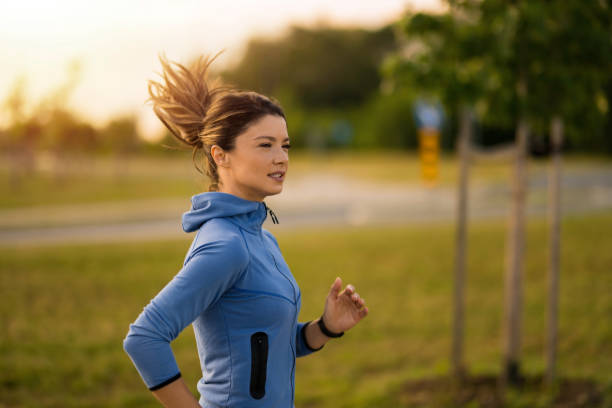 istock Athletic woman running outdoors in the morning. 2172285707