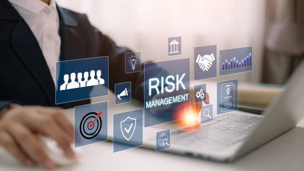 istock A businessman analyzes a virtual risk management interface with critical strategy icons on a laptop screen. Corporate risk management strategy concept. Analyze risk assessment, analysis financial, 2172286427
