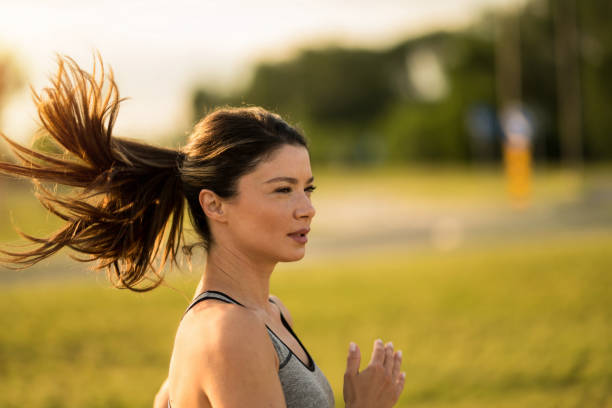 istock Athletic woman running outdoors in the morning. 2172289570