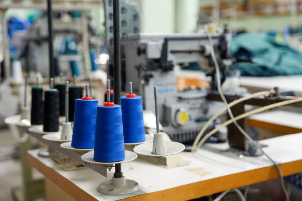 Thread and sewing machine in textile factory without people
