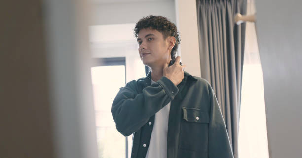 istock Young man wear perfume in Bedroom. 2172294018