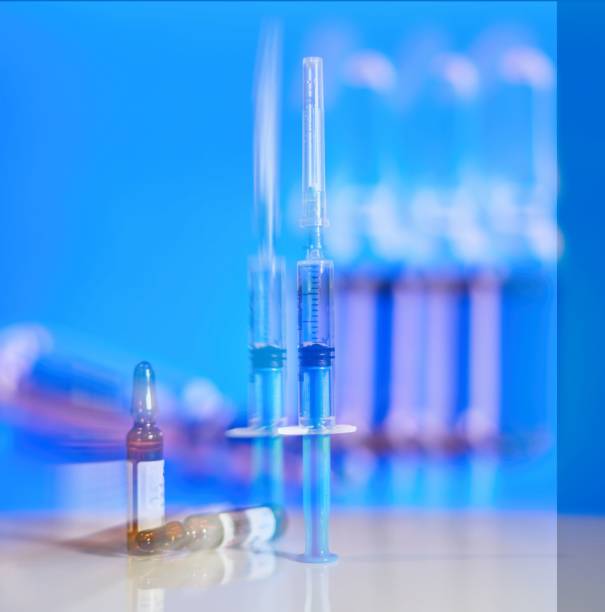 istock a syringe and ampoules with a vaccine are lying on the table 2172294654