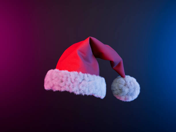 istock Santa claus hat floating on neon background celebrating christmas 2172297460