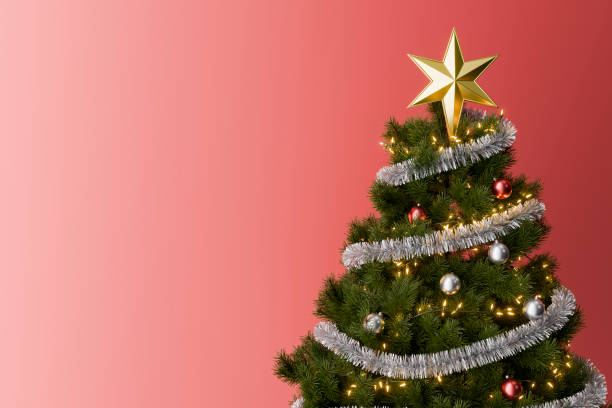 istock Christmas tree with ornaments and lights on red background with copy space 2172297598
