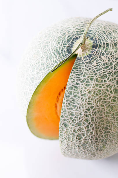 Sliced Cantaloupe isolated on white background.