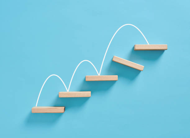 istock Wooden blocks forming increasing graph on blue background 2172298526