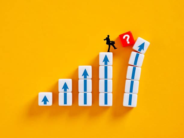 istock Businessman walking towards question mark while climbing up arrow sign stairs 2172298581