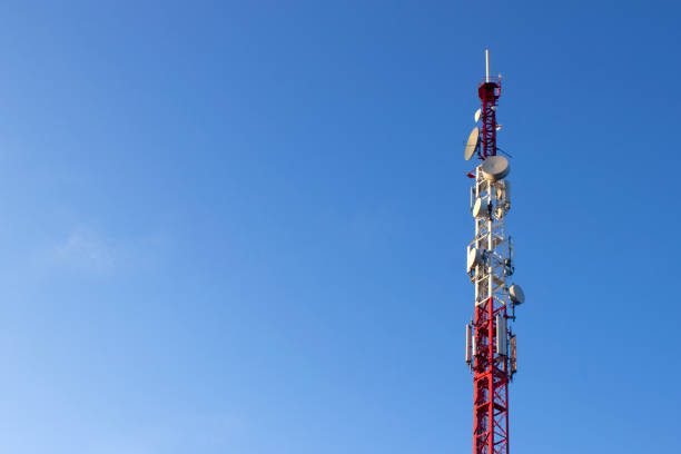 Telecommunication tower of 4G and 5G cellular. Telecommunication tower with antennas against blue sky