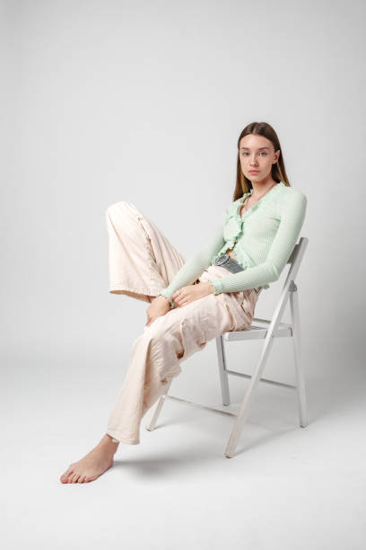 istock Young Woman Model Sitting and Posing in Studio 2172302646