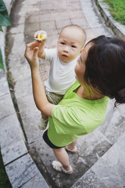 istock Young Asian mother play with her son 2172304251