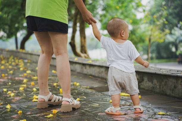 Young Asian mother play with her son