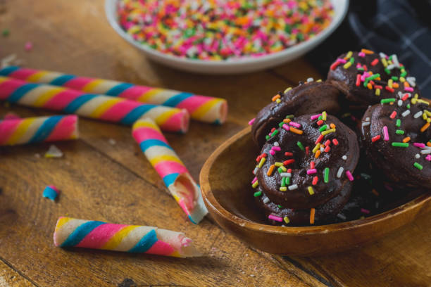 candy with chocolate donut on wooden background