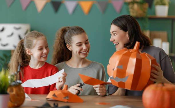 istock Happy family preparing for Halloween. 2172308820