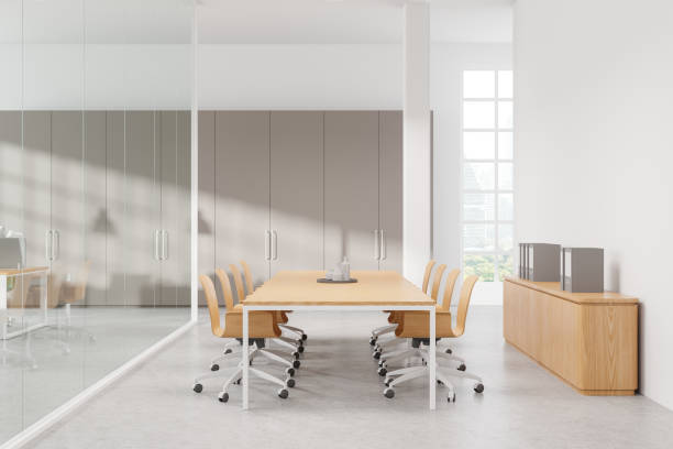 istock White conference interior with meeting board and chairs, panoramic window 2172312898