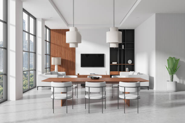 istock Modern dining and living room with large windows and minimalist decor. 3D Rendering 2172313004