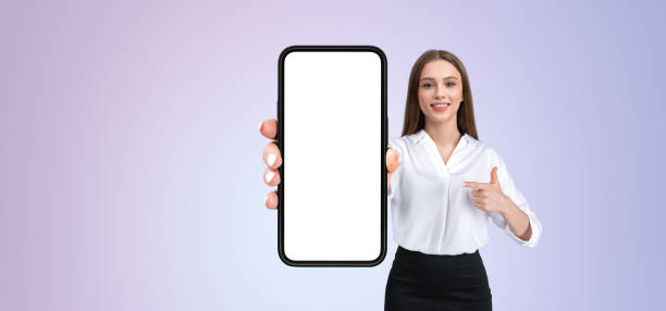 istock Woman holding smartphone with blank screen, pointing to it on gr 2172314751