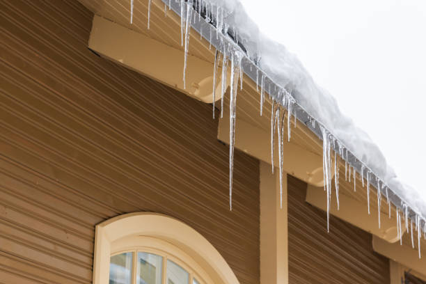 istock Icicles hang on the roof edge 2172315470