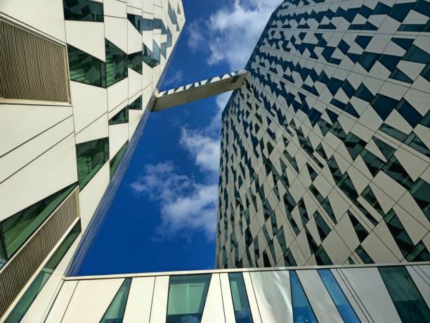 The AC Hotel Bella Sky Copenhagen, formerly the Bella Sky Comwell Hotel, is a 4-star conference hotel adjacent to the Bella Convention and Congress Center in the Ørestad district of Copenhagen, Denmark. The image shows the hotel with th econnection bridge, captured during summer season.