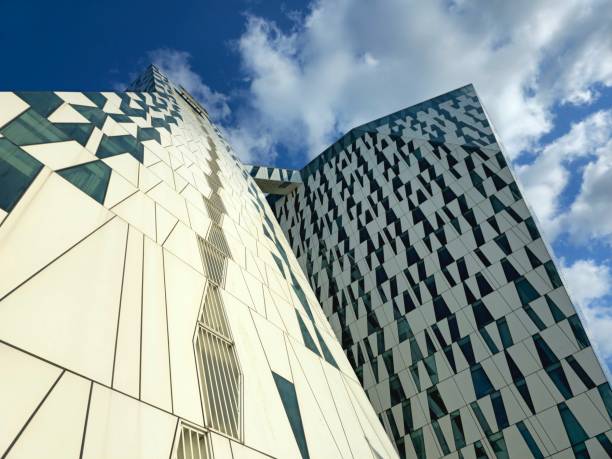 The AC Hotel Bella Sky Copenhagen, formerly the Bella Sky Comwell Hotel, is a 4-star conference hotel adjacent to the Bella Convention and Congress Center in the Ørestad district of Copenhagen, Denmark. The image shows the hotel partially captured during summer season.