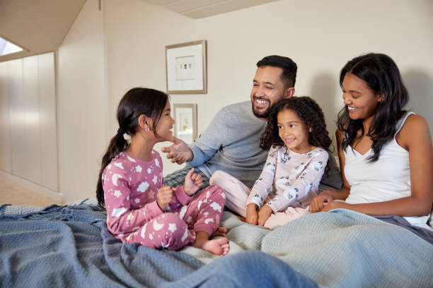 istock Playful indian family talking in bed 2172317524