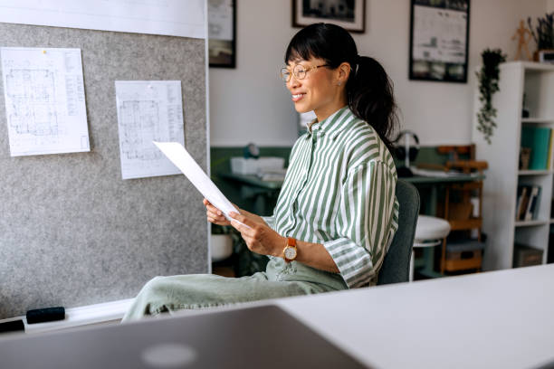 istock Female architect working at her home office 2172318833