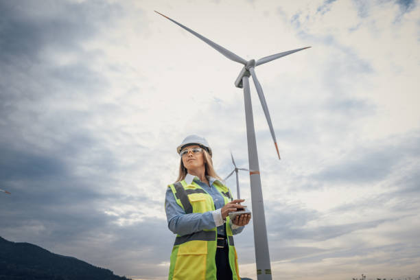 istock A female engineer is working with a wind turbine model in a renewable energy setting, showcasing her skills and advancements in engineering, construction, and environmental sustainability 2172320843