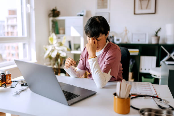 istock Tired female doctor working at modern doctor's office 2172320990