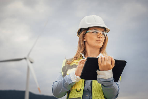 istock An engineer at a wind farm utilizing a tablet for effective project management and oversight of renewable energy initiatives, playing a pivotal role in the advancement of sustainable infrastructure 2172321410