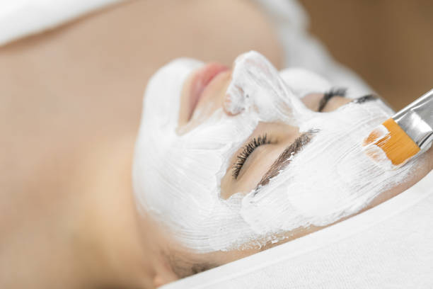 istock Indulge in a peaceful spa experience with a luxurious facial treatment using a white mask for rejuvenating skincare in a serene setting. Enjoy a moment of relaxation and beauty pampering 2172322351