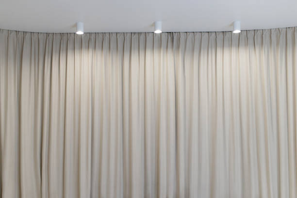 Light curtain that dropped down as a straight line with light bulbs on the ceiling. Background for inserting text, empty spaces.