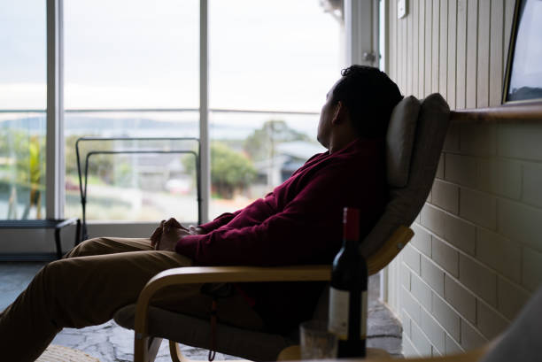 istock Thoughtful man sitting on armchair in balcony 2172322911