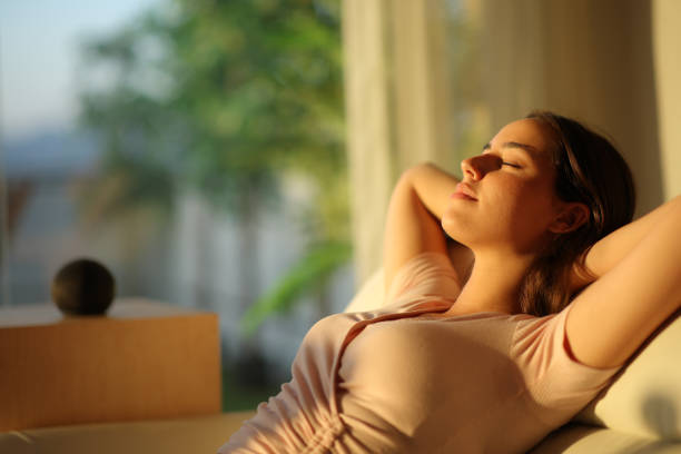 istock Woman relaxing with smart speaker in the background 2172323986