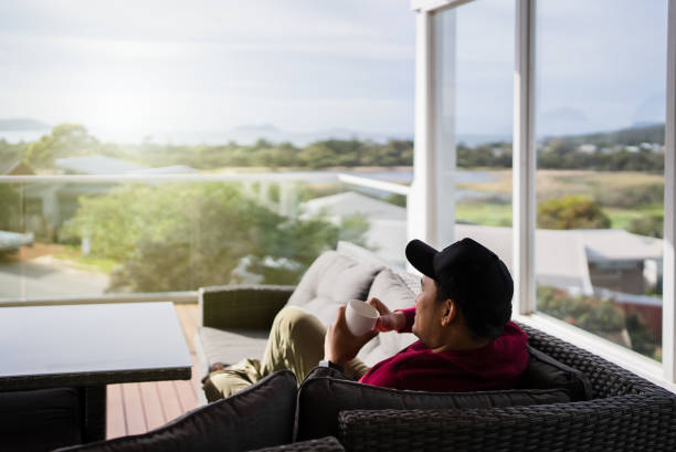 istock man drinking a cup of coffee outdoors 2172325053