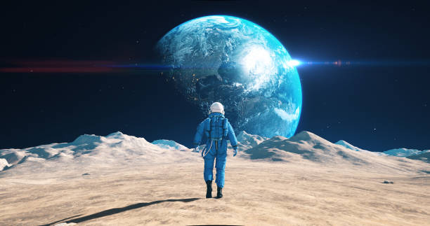 istock Astronaut Walking On The Moon. Blue Planet Earth Visible. 2172326116