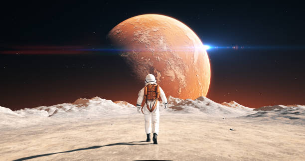 istock Astronaut On An Alien Planet Walking To His Base. Mars Is Visible. 2172326208