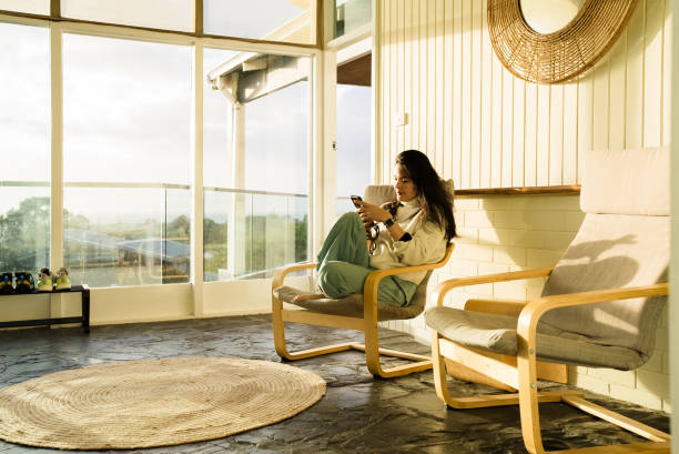 istock Young Asian Chinese woman using smartphone at home 2172326353