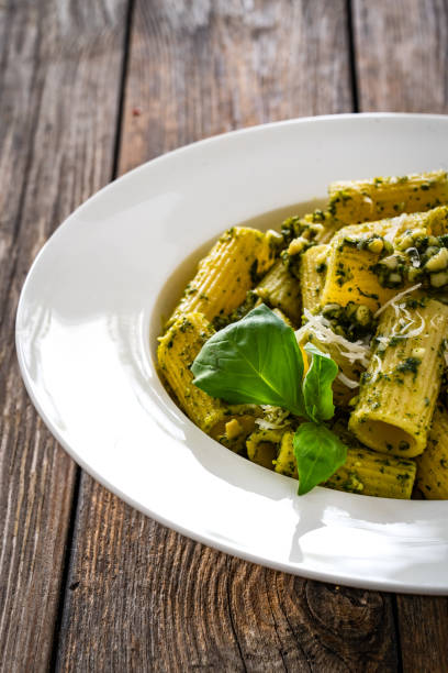 istock Noodles with basil pesto sauce on wooden table 2172332394
