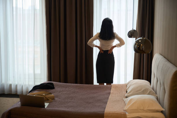 istock Hotel guest is standing in a hotel room 2172334108