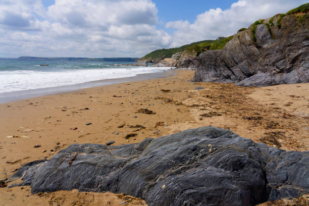 istock A deserted Hemmick beach in Cornwall at low tide. 2172334463