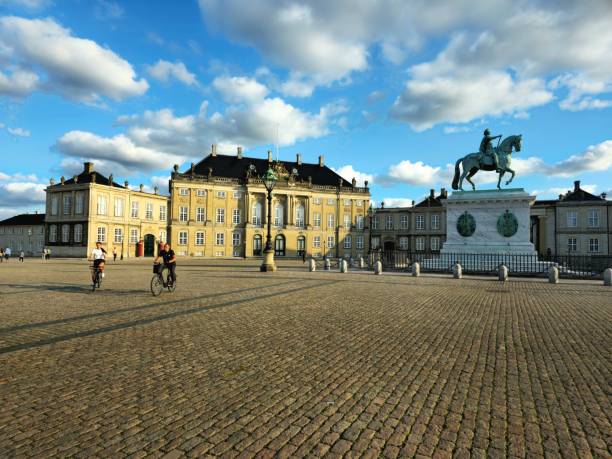 Amalienborg Slotsplads Copenhagen with the sourrounding official residence for the Danish royal family . Captured at sunset during summer season.
