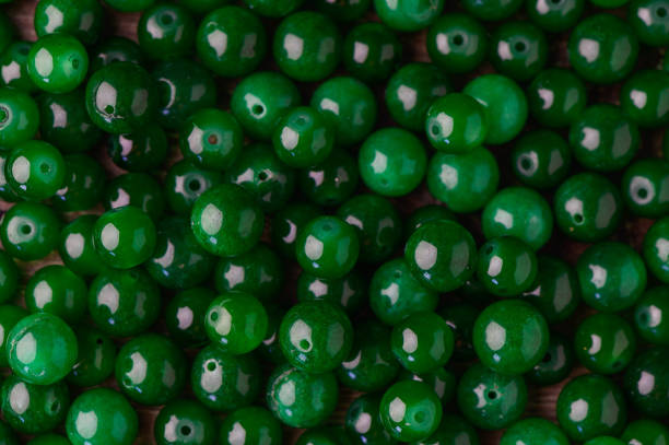 istock green real stone beads for making beads as background 1 2172336884
