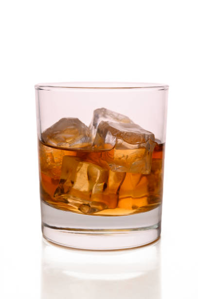 istock Glass of scotch with ice on white background 2172336919