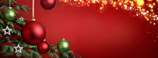 Red Christmas background with fir tree closeup stock photo