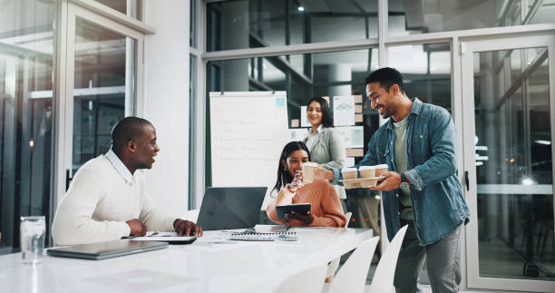 istock Business people, meeting and night with coffee for teamwork strategy or planning project together at office. Group, employees and working late with caffeine for company mission, idea or brainstorming 2172341389