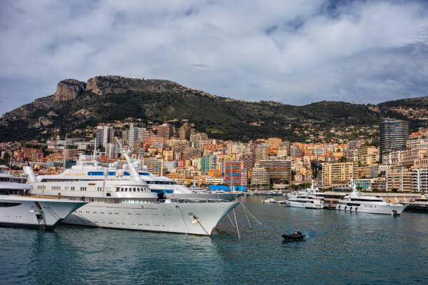 Principality of Monaco - April 14, 2018 - City skyline with luxury yacht in Port of Hercule on the French Riviera.